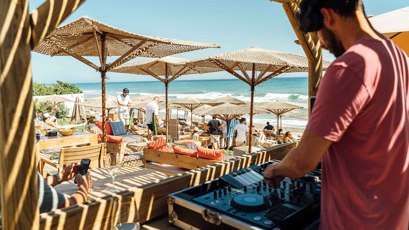 dj playing on the beach