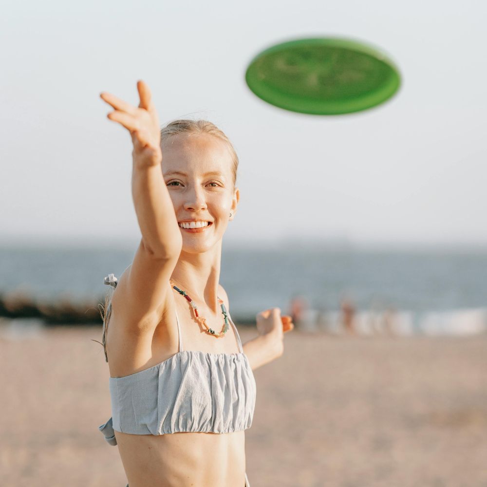 woman playing with frisbee