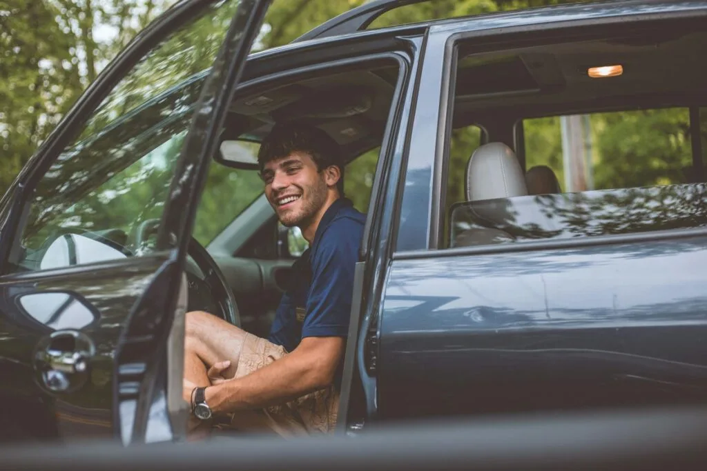 man getting out of a car